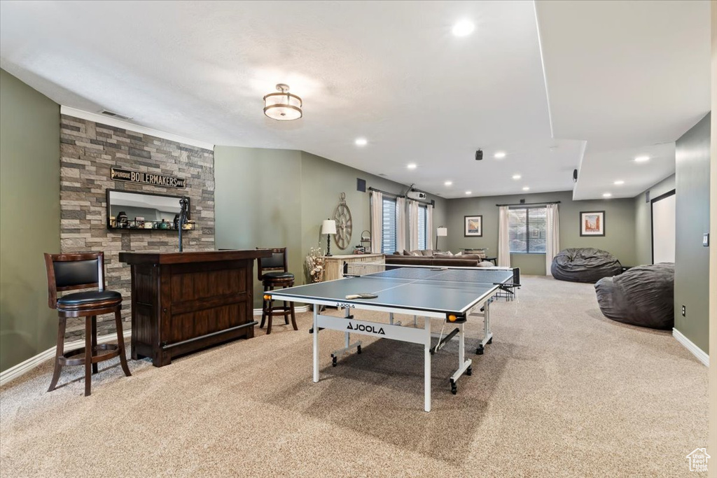 Recreation room with visible vents, baseboards, a bar, carpet flooring, and recessed lighting