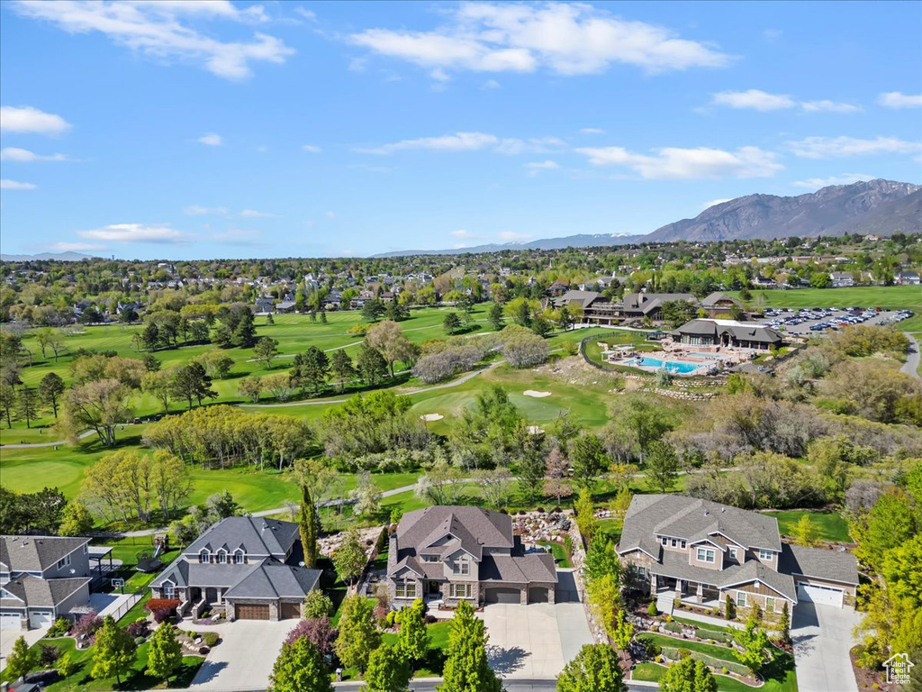 Drone / aerial view with a mountain view, golf course view, and a residential view
