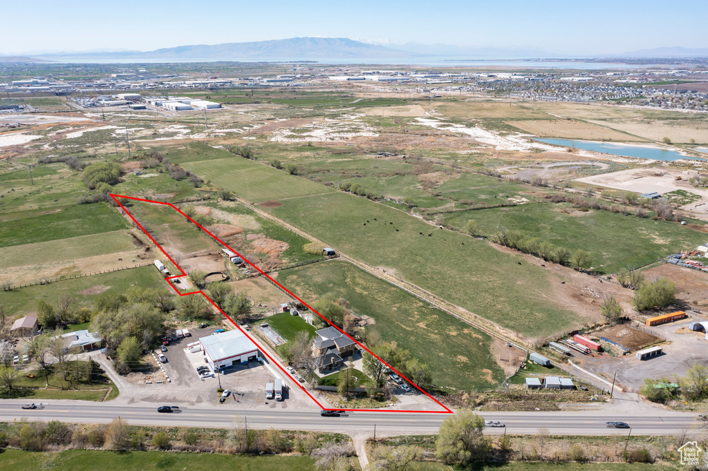 Aerial view featuring a rural view and a water and mountain view