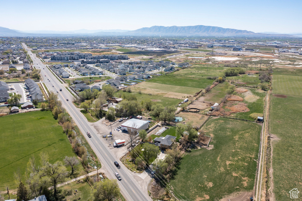 Birds eye view of property with a mountain view