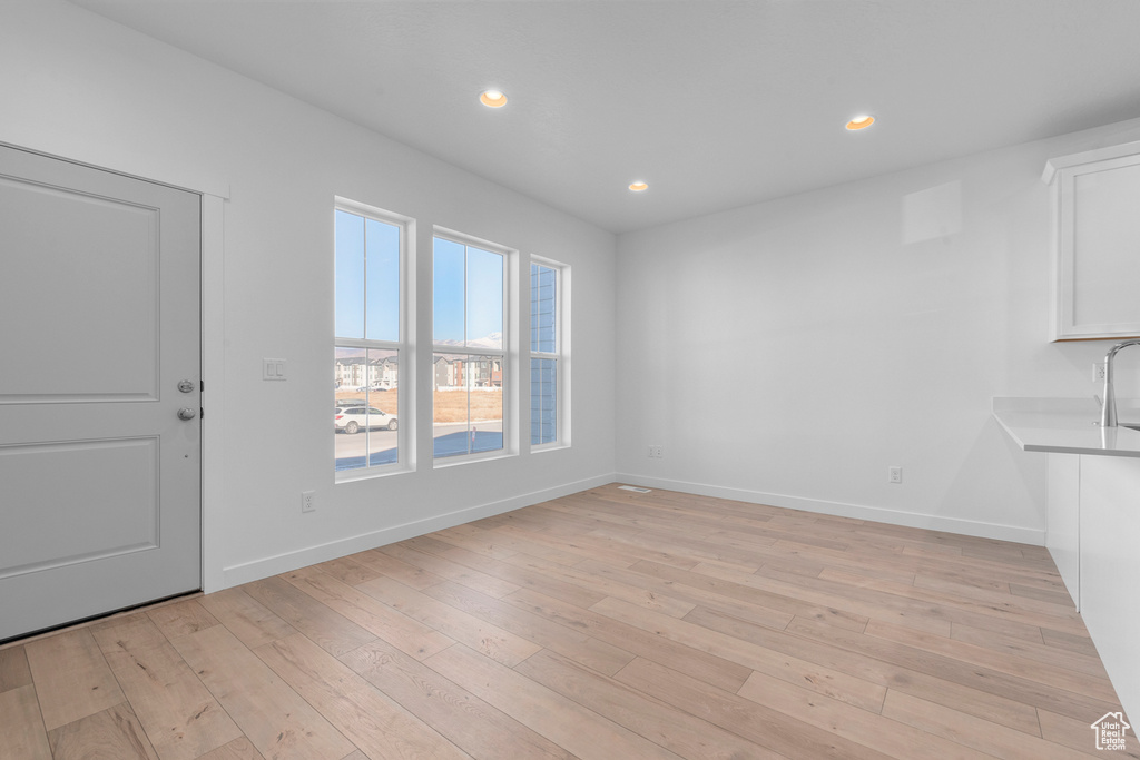 Interior space featuring recessed lighting, baseboards, and light wood-style floors
