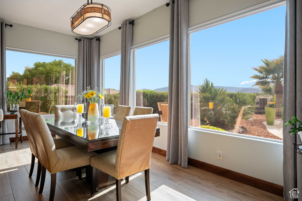 Sunroom featuring a mountain view