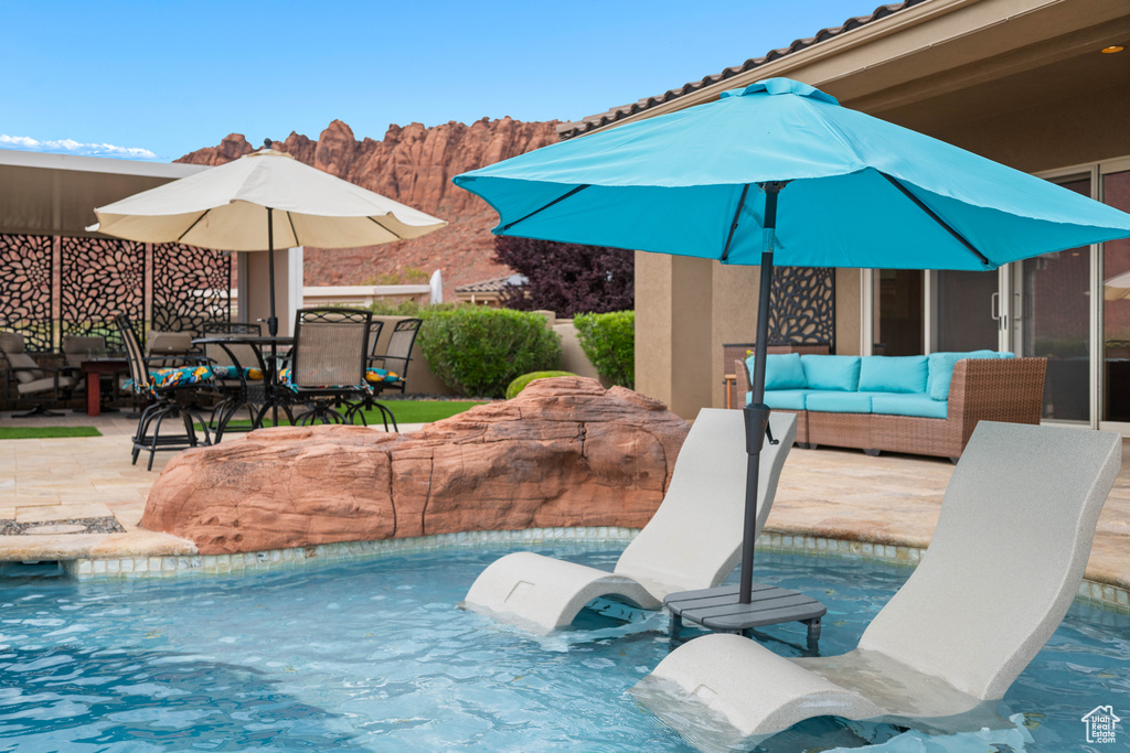 Outdoor pool featuring a patio