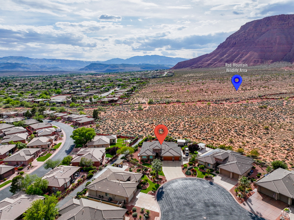 Drone / aerial view with a residential view and a mountain view