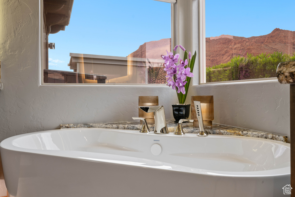 Details featuring a textured wall and a mountain view