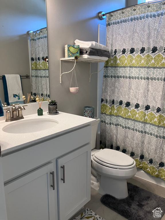 Bathroom featuring vanity and tile patterned floors