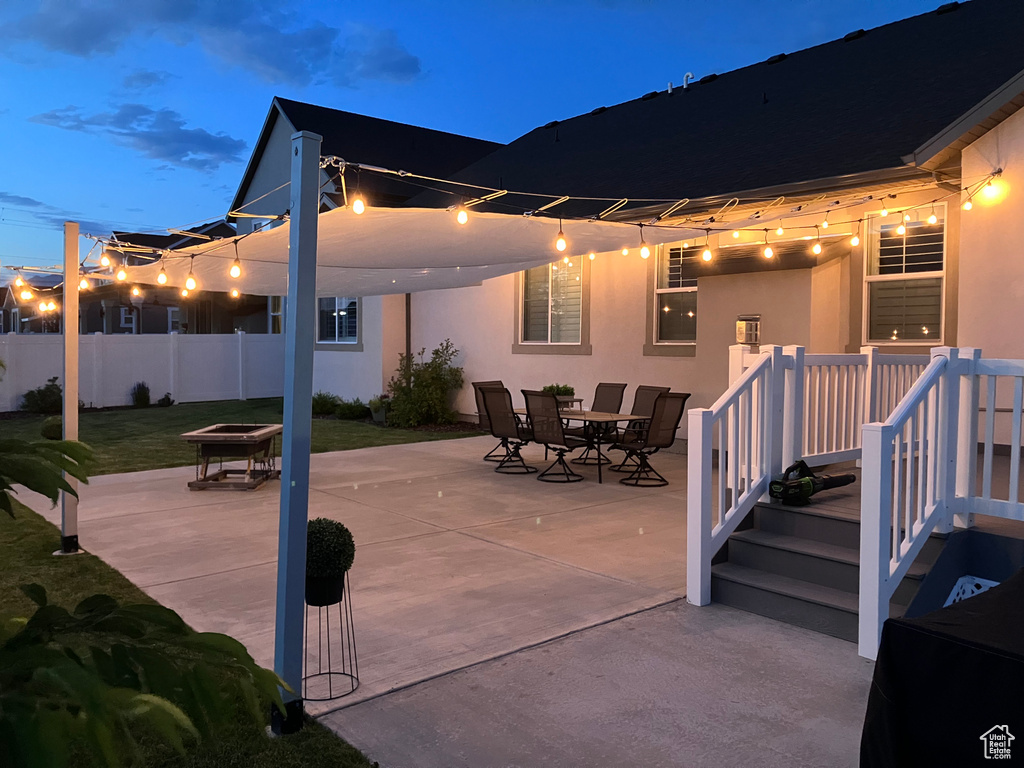 View of patio with an outdoor fire pit and outdoor dining space