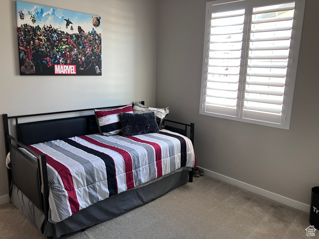 Carpeted bedroom with baseboards