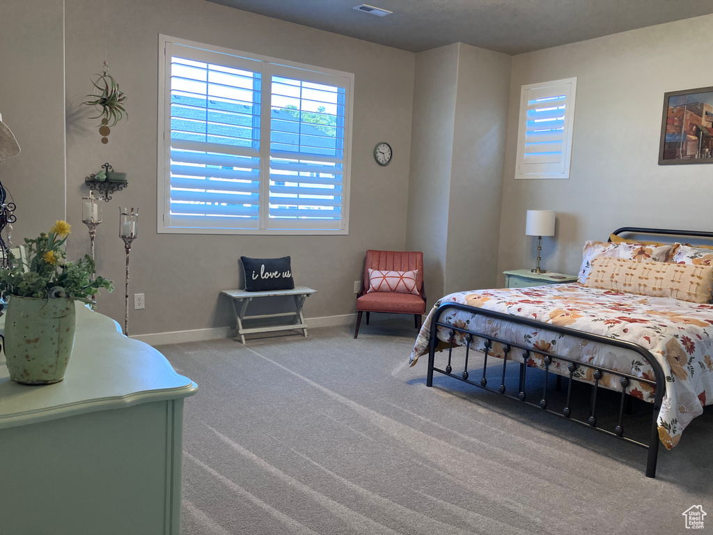 Carpeted bedroom with baseboards