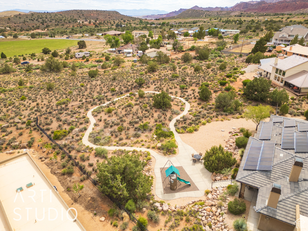 Drone / aerial view with a residential view and a mountain view