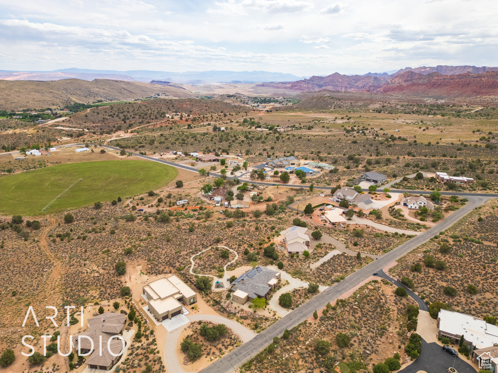 Drone / aerial view featuring a rural view, a mountain view, and a desert view