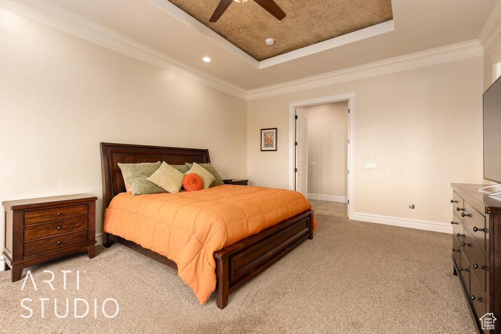 Bedroom featuring crown molding, baseboards, light colored carpet, recessed lighting, and a tray ceiling