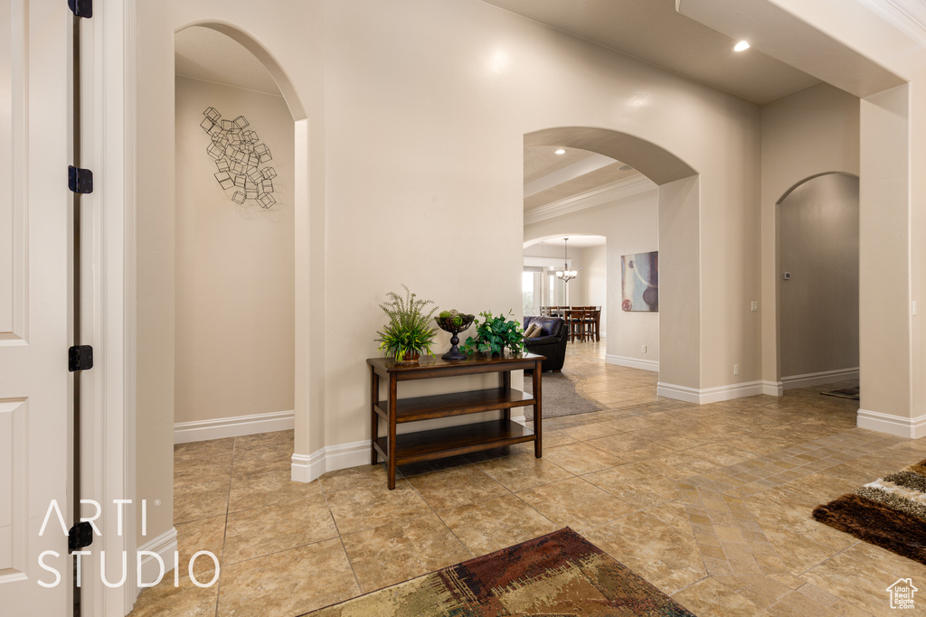 Corridor with arched walkways and baseboards