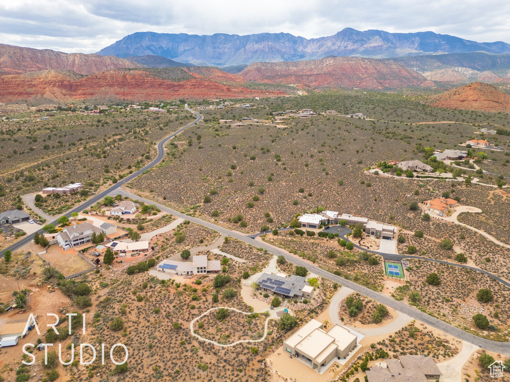 Birds eye view of property featuring view of desert, a mountain view, and a rural view