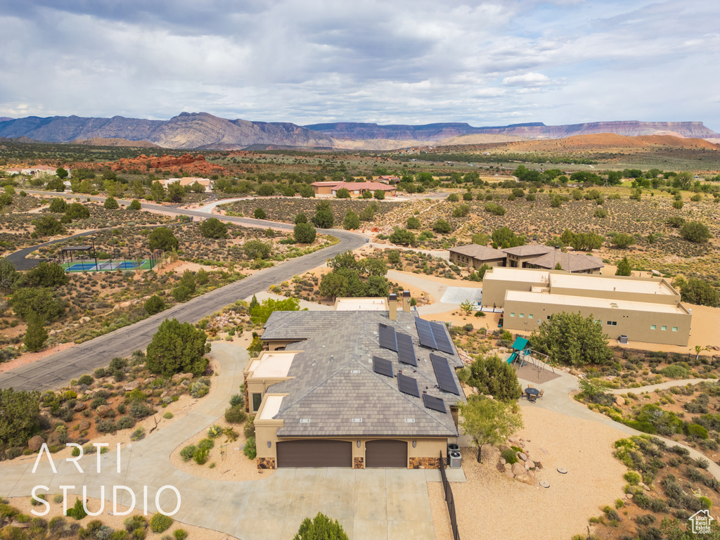 Aerial view featuring view of desert and a mountain view