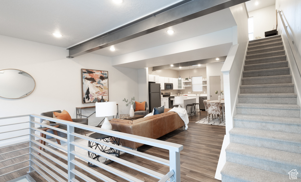 Interior space with stairway, recessed lighting, and wood finished floors
