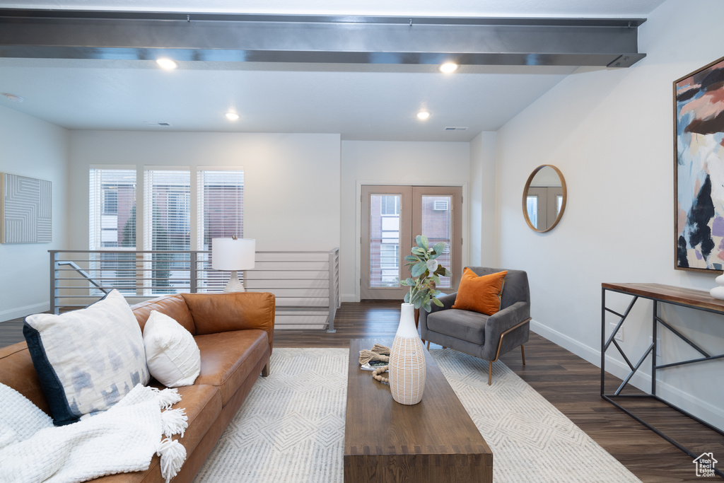 Living area featuring recessed lighting, baseboards, and wood finished floors