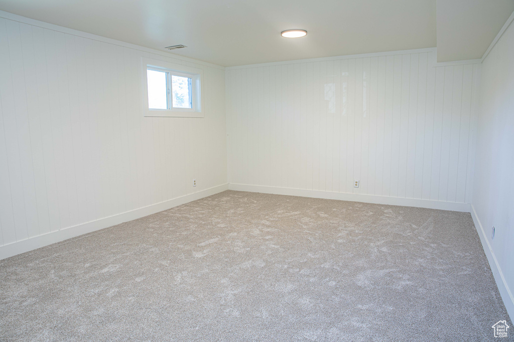 Below grade area with baseboards and carpet