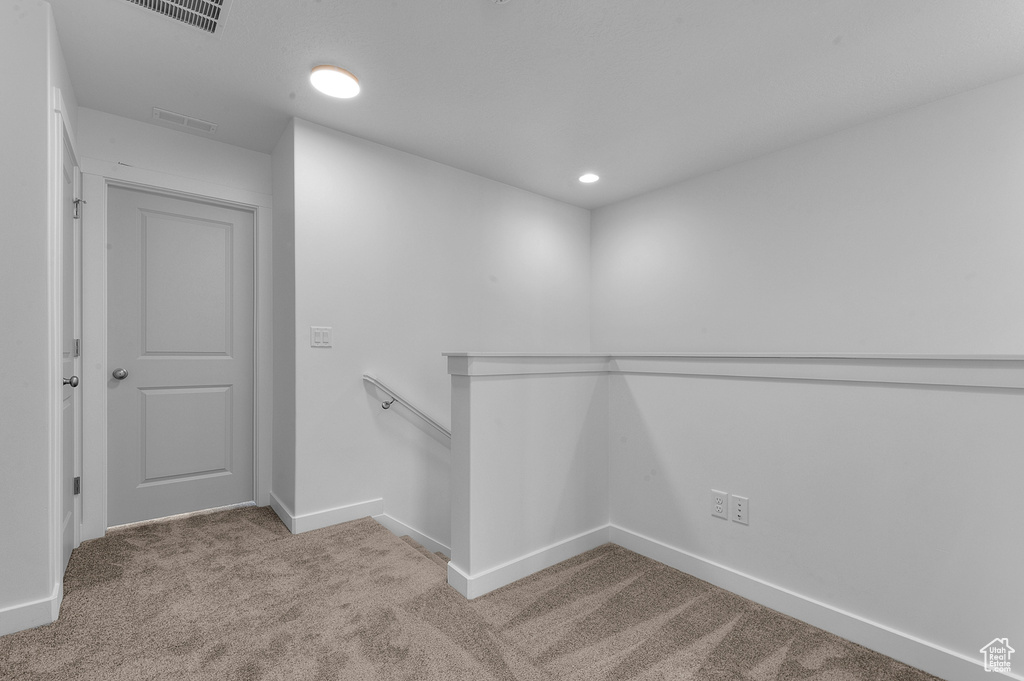Walk in closet featuring carpet floors and visible vents