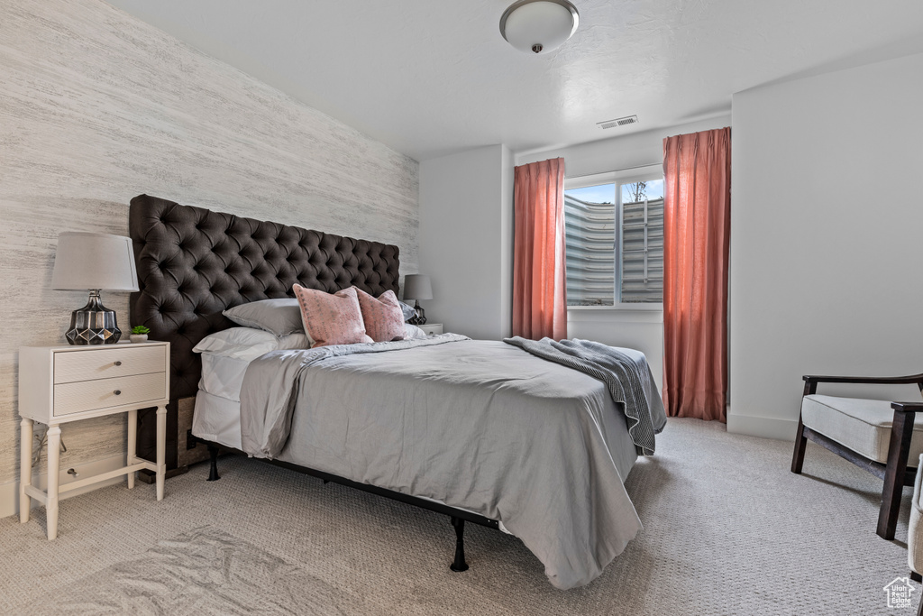Bedroom featuring visible vents and carpet floors