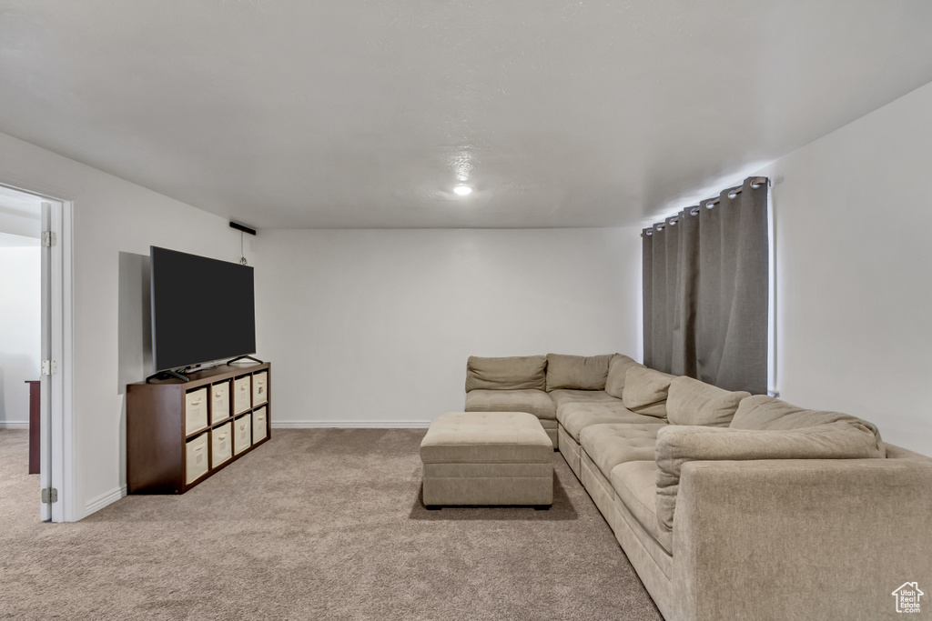 Living room with carpet floors and baseboards