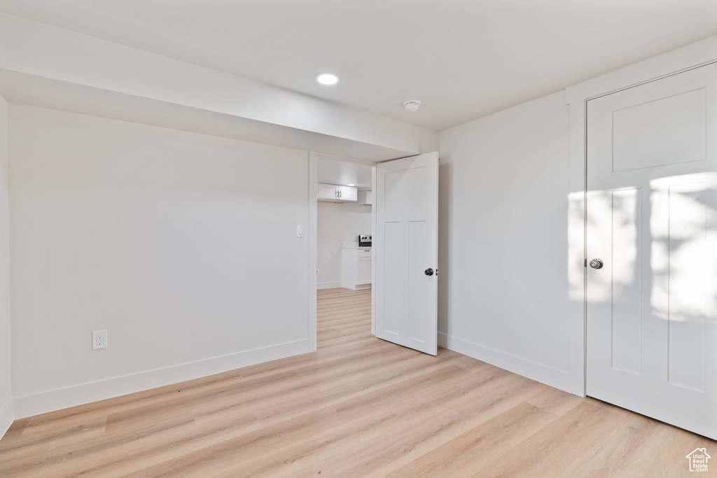 Unfurnished bedroom with baseboards, recessed lighting, and light wood-style flooring