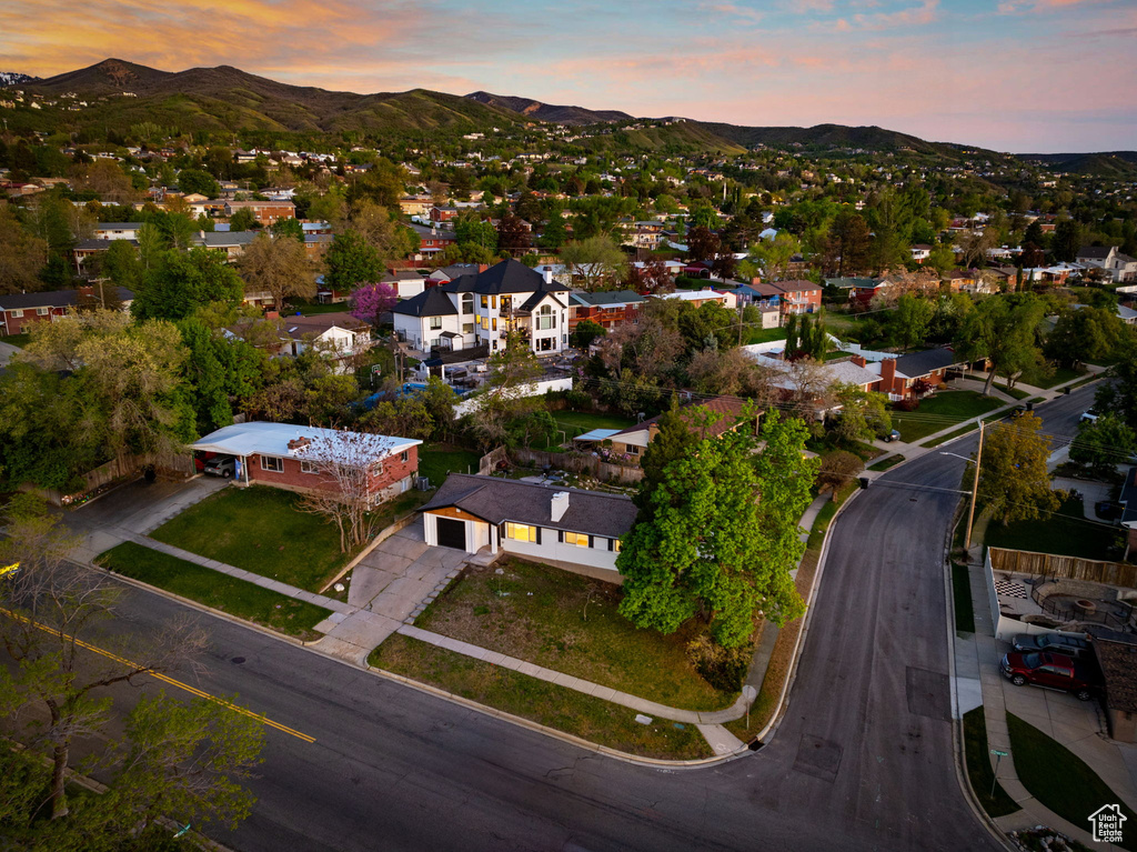 Aerial view at dusk featuring a residential view and a mountain view