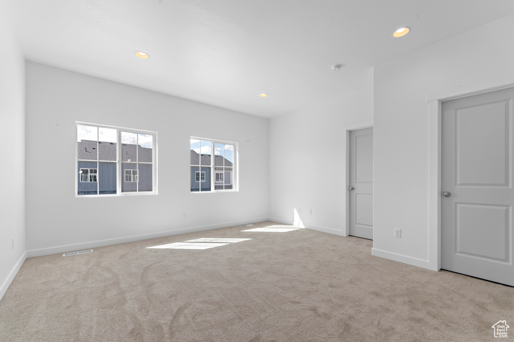 Unfurnished bedroom with recessed lighting, baseboards, and carpet