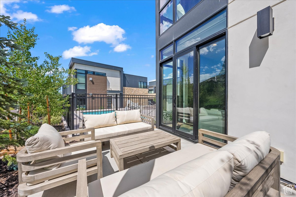 View of patio / terrace with a fenced in pool and an outdoor hangout area