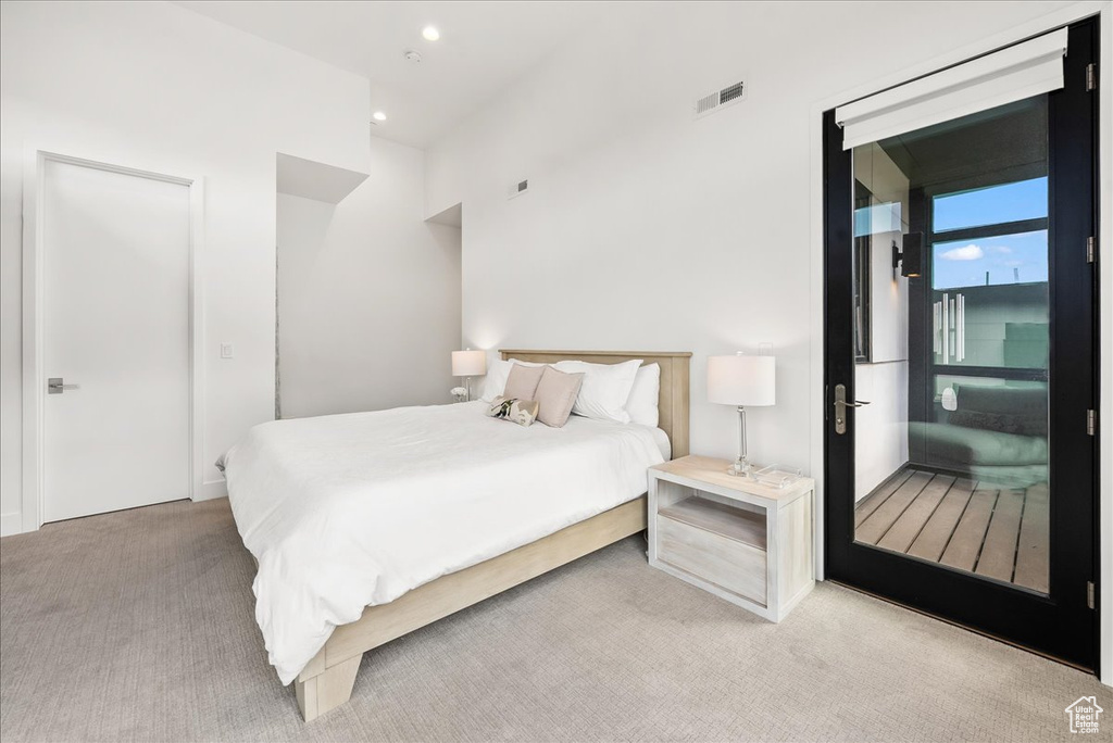Carpeted bedroom featuring visible vents and recessed lighting