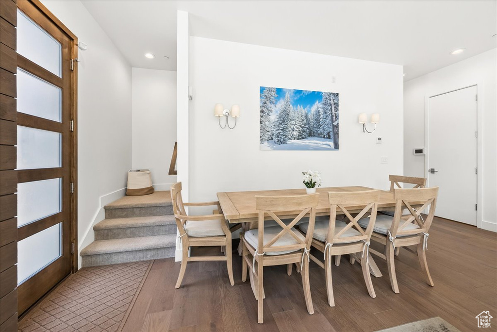 Dining area with recessed lighting and wood finished floors