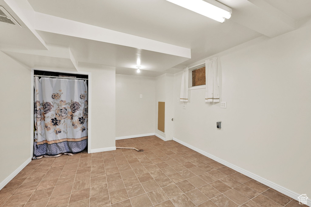 Finished below grade area with baseboards and visible vents