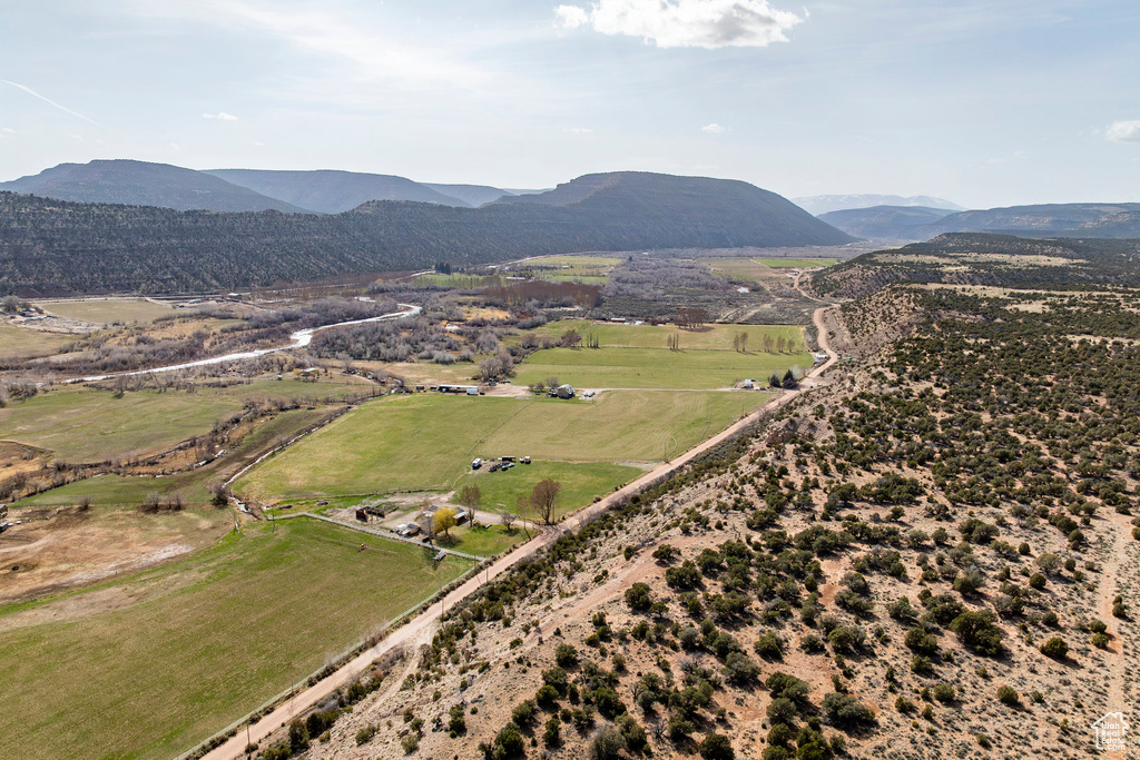 Drone / aerial view with a mountain view and a rural view