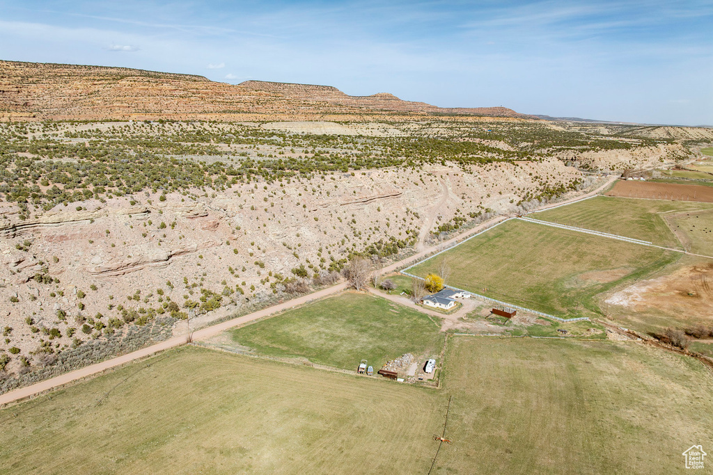Birds eye view of property with a mountain view and a rural view