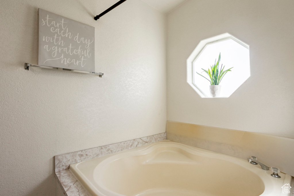 Full bathroom with a bath