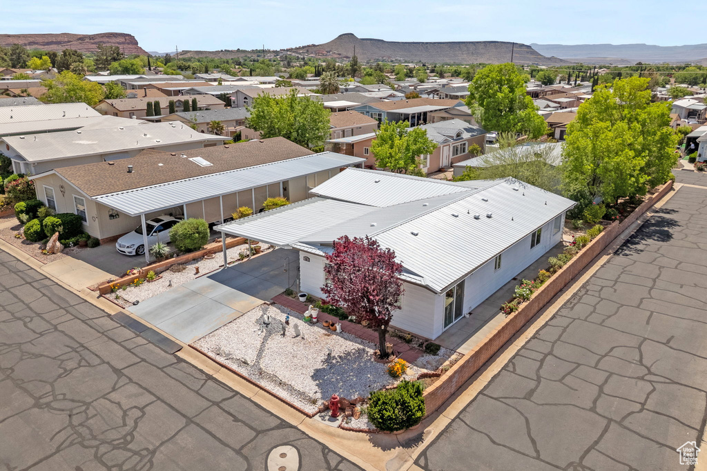 Birds eye view of property featuring a mountain view and a residential view