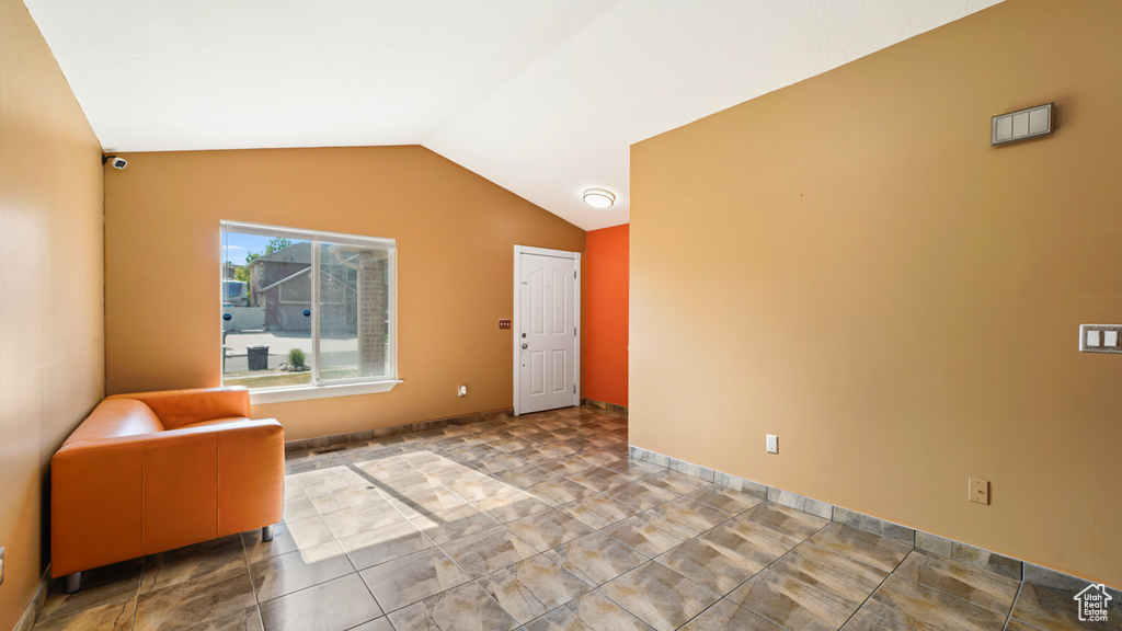 Sitting room featuring vaulted ceiling