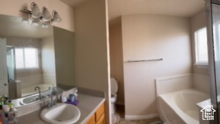 Full bathroom with a bath and vanity