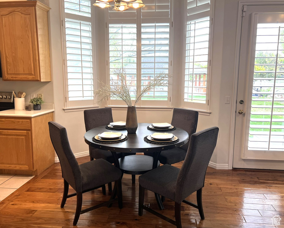 Dining room with baseboards and hardwood / wood-style floors