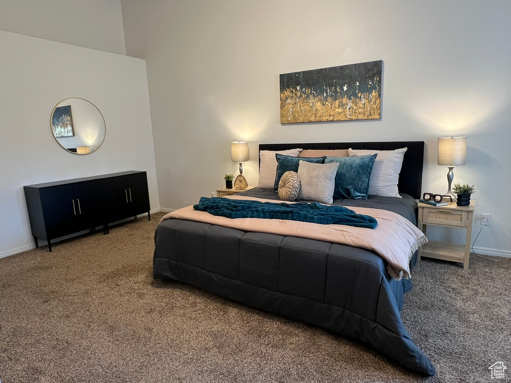 Carpeted bedroom with baseboards