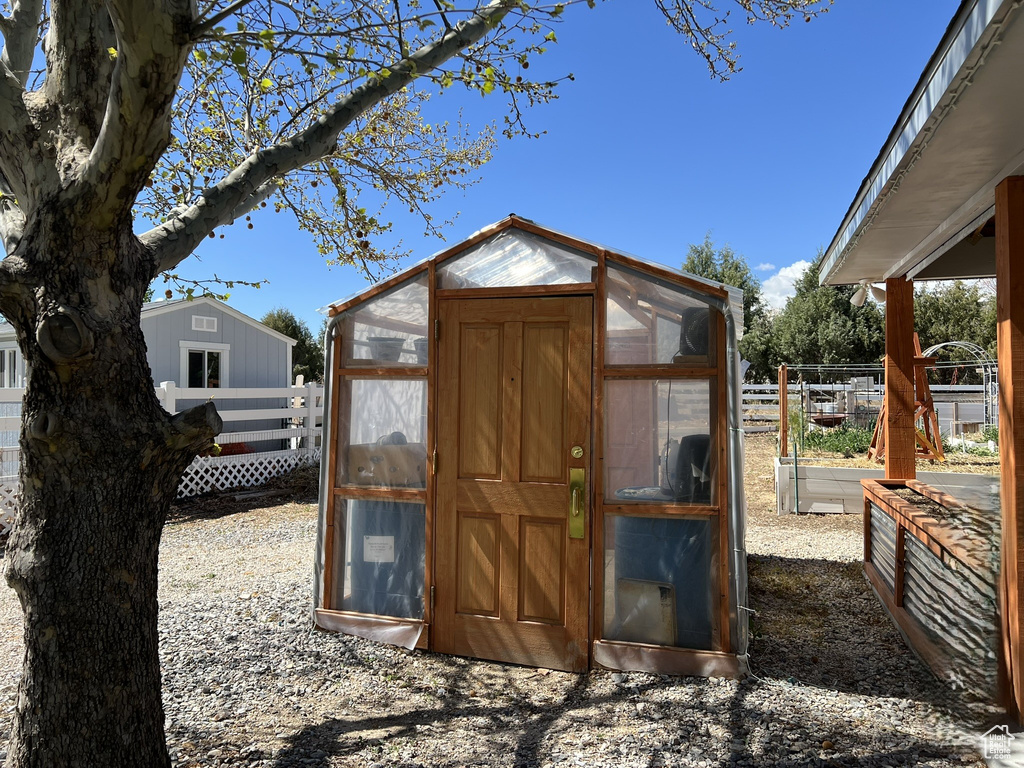 View of greenhouse with fence