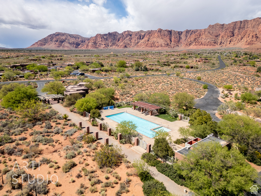 Birds eye view of property with a mountain view