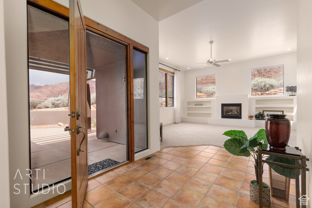 Interior space with visible vents, french doors, recessed lighting, and light colored carpet