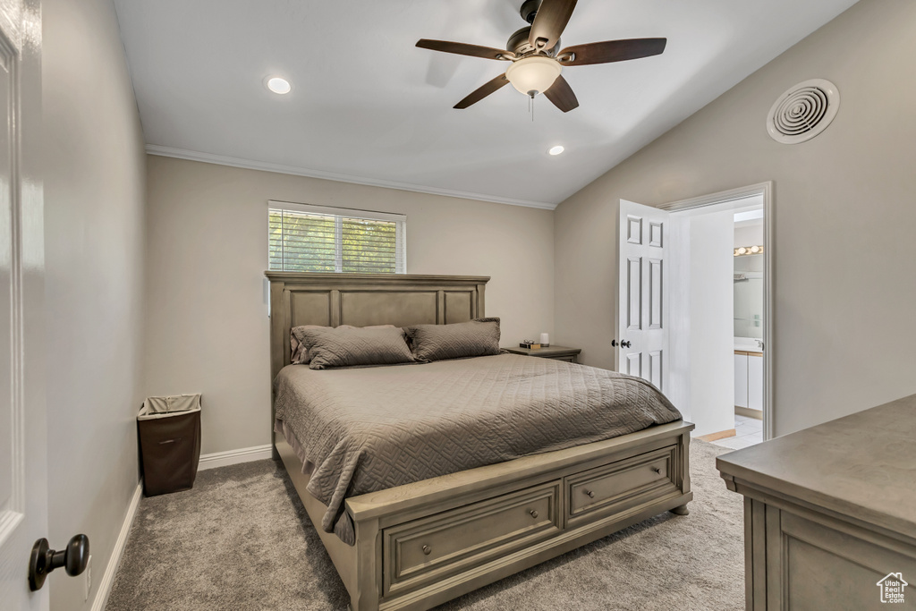 Bedroom with light colored carpet, recessed lighting, baseboards, lofted ceiling, and visible vents