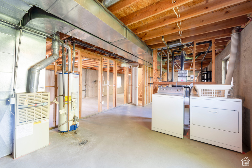 Unfinished below grade area with independent washer and dryer and gas water heater