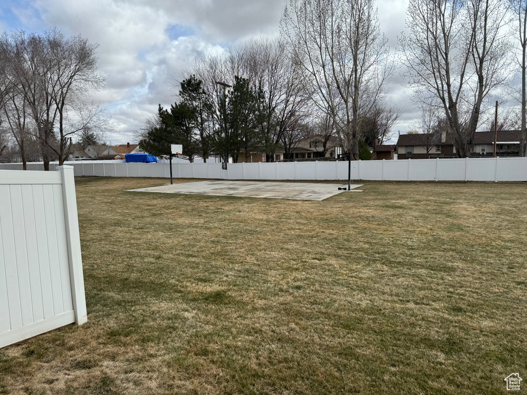 View of yard featuring fence