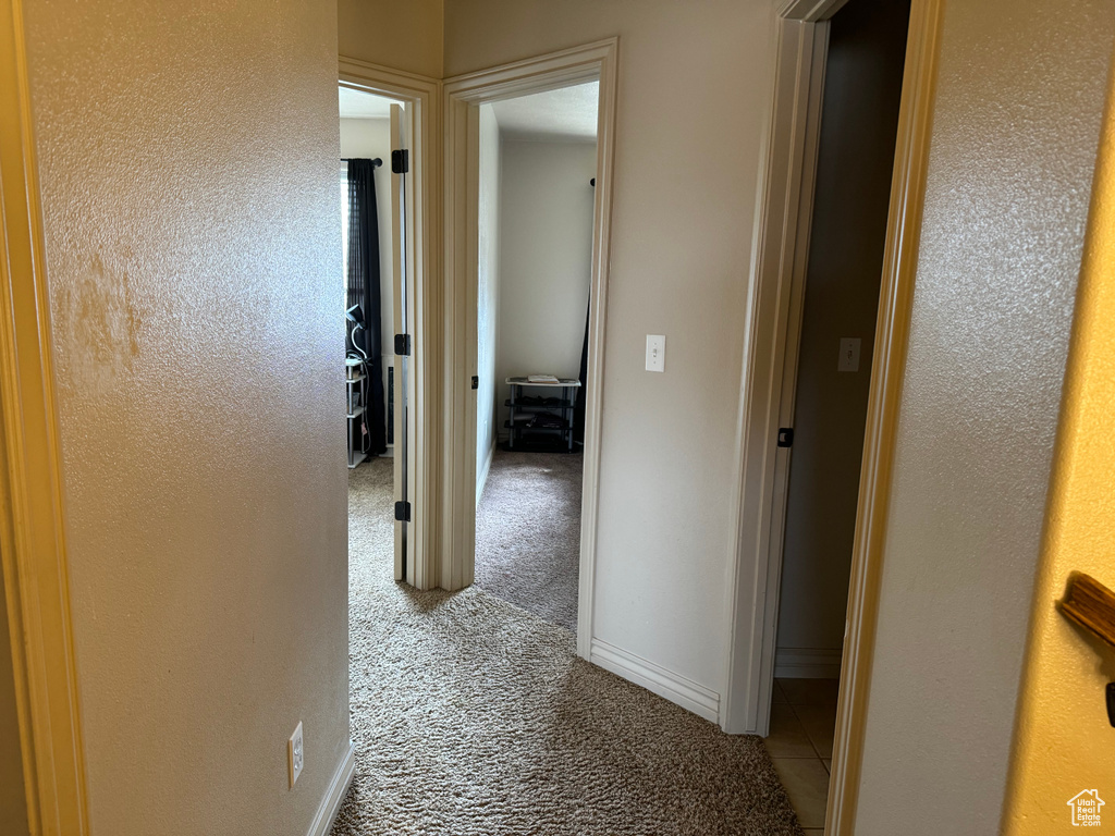 Hallway with light colored carpet