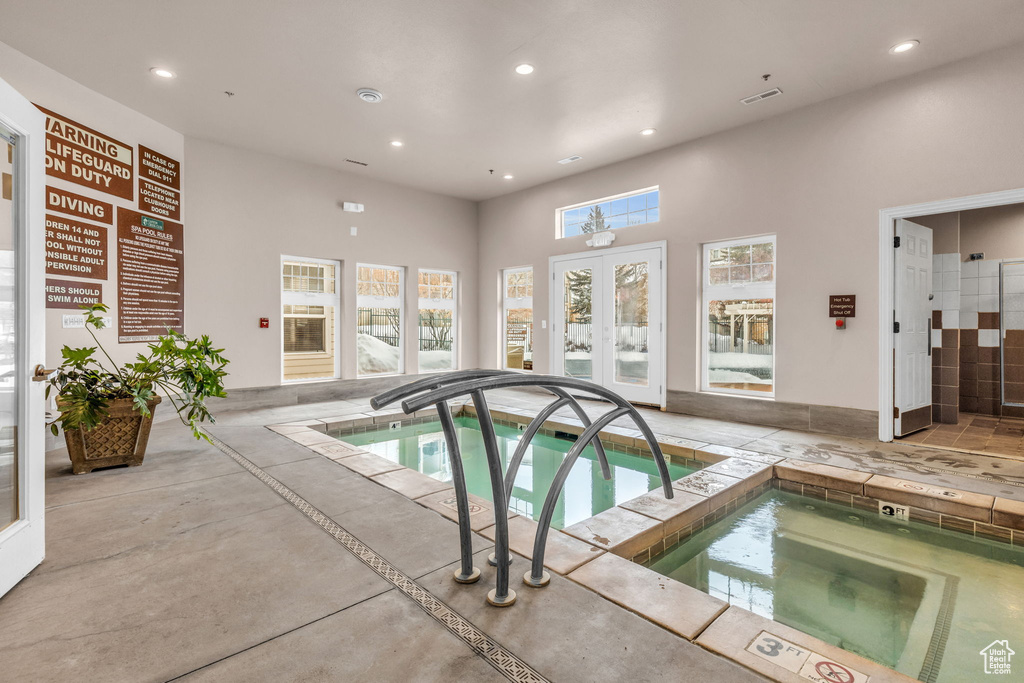 View of swimming pool featuring a swimming pool and an indoor hot tub