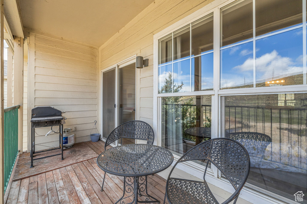Wooden terrace featuring grilling area