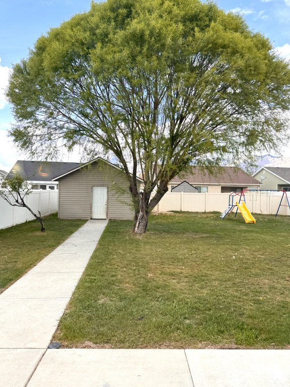 View of yard featuring fence